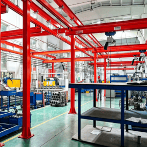 Floor-mounted KBK crane system installed along automated assembly line