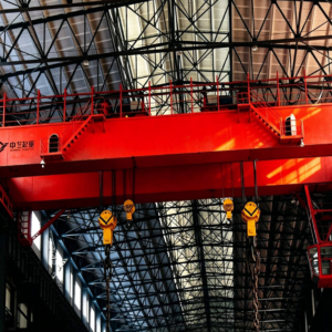 Double girder trolley overhead crane lifting long steel pipes with synchronized dual trolleys