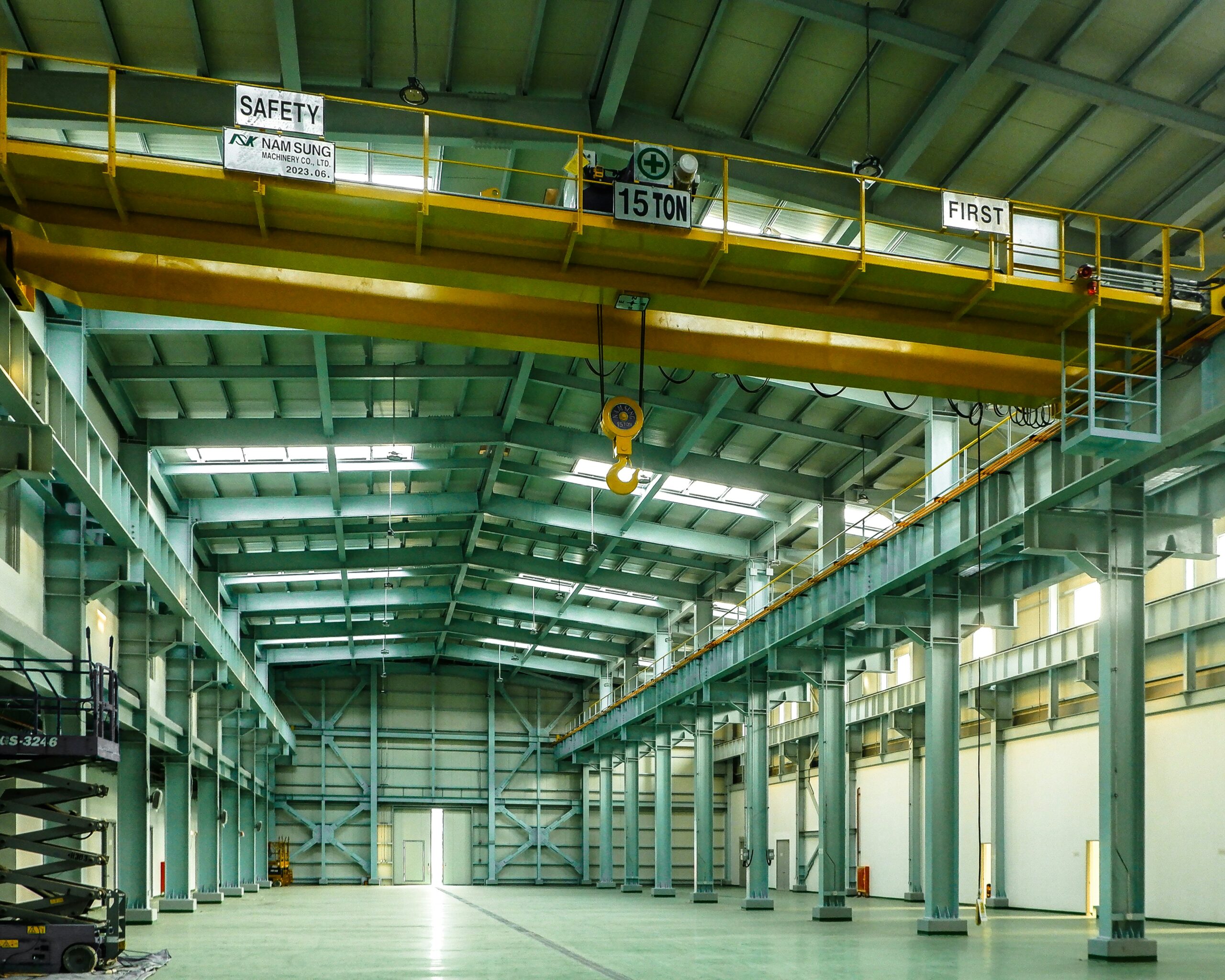 Cranox double girder overhead crane operating in industrial manufacturing workshop